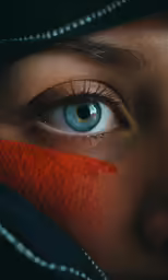 a woman with blue eyes is looking into the camera