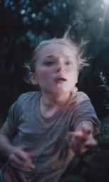a young boy with a light shining on him