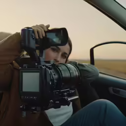 a woman taking a picture with her camera