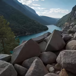 large rocks in the water surrounded by mountains