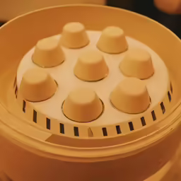 a closeup of a container containing several hats