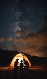 people sitting at the base of a tent under a night sky full of stars,three people sitting around a glowing orange tent with night sky in the background