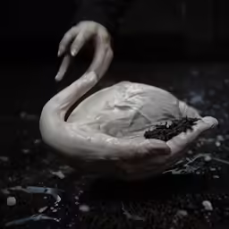 a sculpture of a bird made out of clay