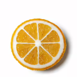 a orange cut in half on top of a white table