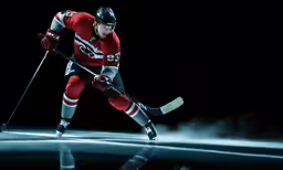 a man playing ice hockey on a frozen rink