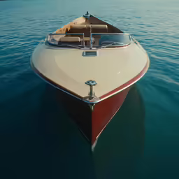 the bow end of a boat sitting on the water
