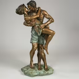 a sculpture depicting two children hugging on their backs,a sculpture depicting a couple hugging in love