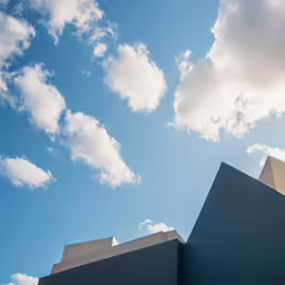 the top of a building with a clear sky