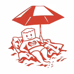 a person is sitting under an umbrella on the beach