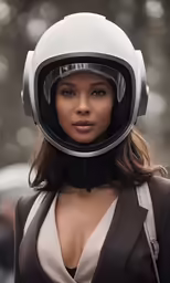 a woman with a helmet on posing for the camera