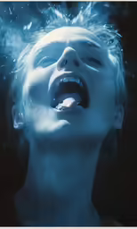 a young person underwater in the blue water
