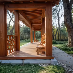 an outside walkway with two wooden benches