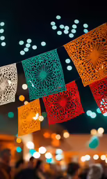 colorful paper cut doilys are hanging in the dark