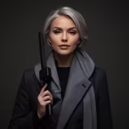 the woman is holding up a large umbrella