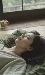 the woman is laying down on her stomach