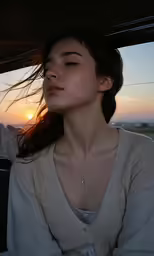 a woman driving in the sun down