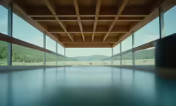 an empty room with a view of mountains