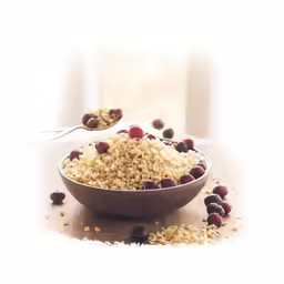 a bowl filled with seeds and a spoon