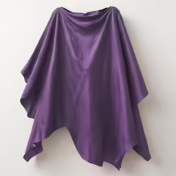 a hand made poncho with a purple design