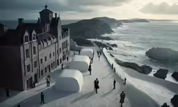 an aerial view of people walking near the water