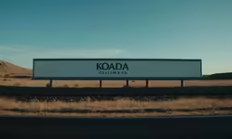 a billboard is on the side of the road