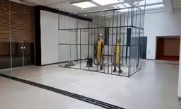 a white room has an abstract display case