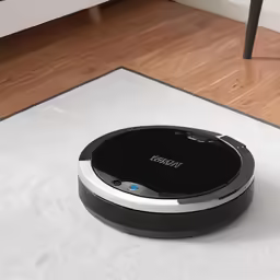 a roomba that is laying on the floor