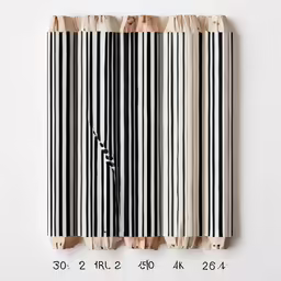 three pieces of torn striped material with lines