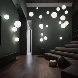 a modern hallway with several suspended globe lights