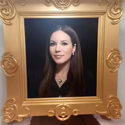 the woman with long dark hair is pictured in the picture