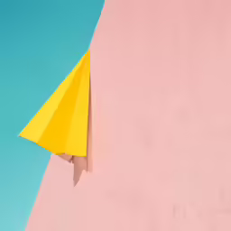 yellow umbrella against pink and blue background