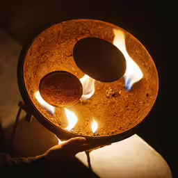 two rocks sit on top of an open pot