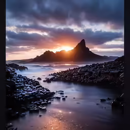 an ocean shore with low tide and rocks and clouds