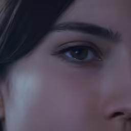 close up of the face of a woman with brown eyes