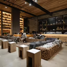 there are people lounging in a large room