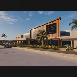 a parking lot surrounded by palm trees and building