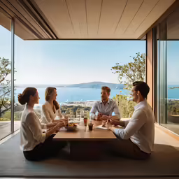 three people are having a glass of wine with a view