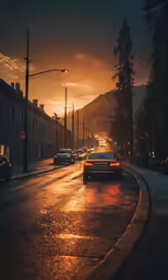 two cars on the road as the sun goes down