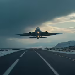 an airplane taking off over a road in the snow