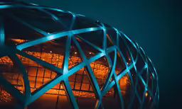 a sculpture is lit up in the dark