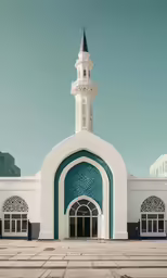 a white and blue building with a tall tower