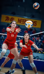 the volleyball players are playing a game in the gym