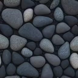 several gray rocks in close up laying side by side