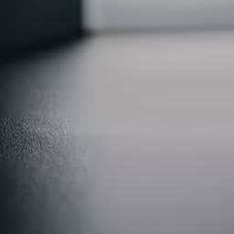 a silver colored surface with small light spots