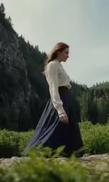 a woman in white shirt and long black skirt