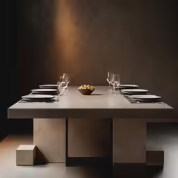 a long table with plates on it in a room