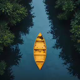 a yellow canoe floating on top of a blue river