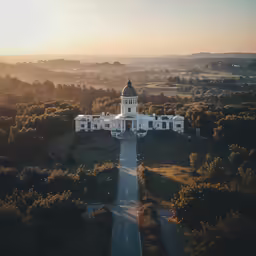 an aerial view of a building in the middle of a countryside
