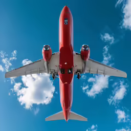 an airplane flies in the sky and looks up