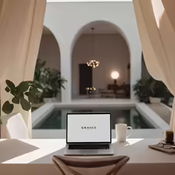 an open laptop computer sitting on top of a table